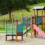 Epsilon inclusive playground fa és fém elemekből álló játszótéri mászóka és csúszda gyerekeknek.
