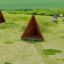 Tipi Nature wooden house háromszög alakú fa játszóház zöld játszótéren.